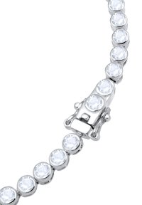 Armband in Silber-Optik, das runde klare Kristalle in einem glatten Metallband zeigt, mit einem sichtbaren Verschluss in der Mitte für eine sichere Schließung.