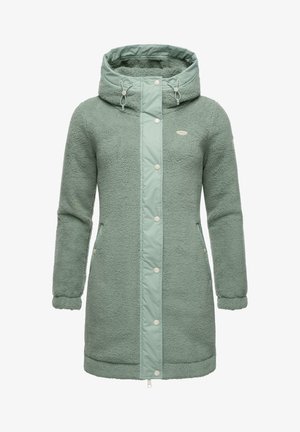 Vihreä fleece-takki, jossa on tikattu etupaneeli, suunniteltu hupulla, sivutaskuilla ja napitaiteilla. Pehmeä rakenne ja rento istuvuus.