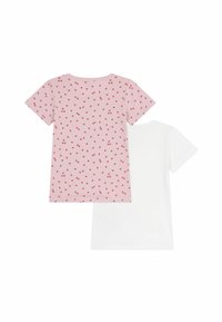 Pink t-shirt with small red cherry patterns, short sleeves, and a round neckline, paired with a plain white t-shirt, both in soft cotton.