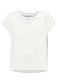 Bílý top s krátkým rukávem s propracovanými výřezy, obsahující geometrické vzory a kulatý výstřih. Lehce prodyšný materiál.