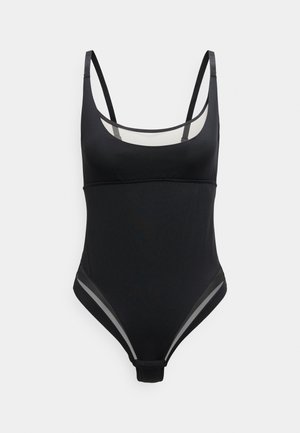 Maillot de bain une pièce noir avec fines bretelles ajustables et panneaux en mesh transparent près de la poitrine et des hanches.