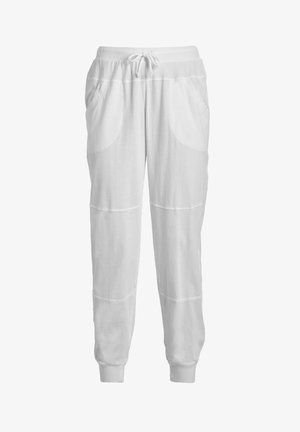 Białe bawełniane dresowe spodnie z wiązanym pasem, kieszeniami bocznymi i prążkowanymi mankietami; charakteryzują się gładką fakturą i subtelnym detalem w postaci przeszyć.