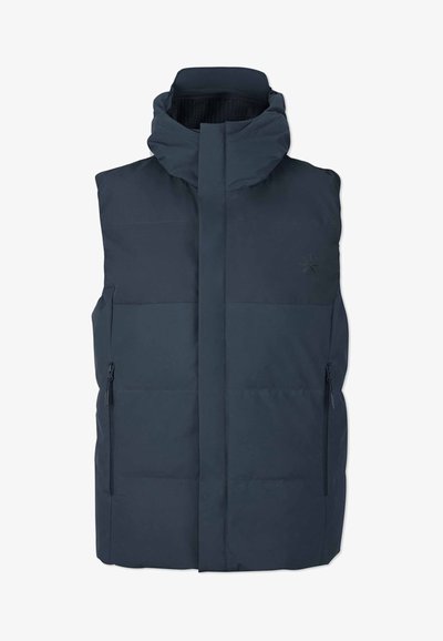 Navyblå puffväst med hög krage, framzippering och två sidofickor med dragkedja. Har en quiltad design och slät textur.