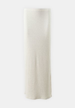Knit maxi skirt in light beige with vertical ribbing. Features a side slit for added movement. Smooth texture and fitted design.