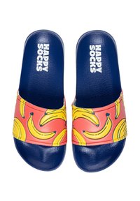 Colorful slide sandals featuring a pink strap with yellow banana patterns, navy footbed, and "HAPPY SOCKS" logo in white.