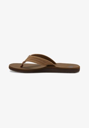 Chinelo castanho com duas tiras curvas e estreitas. Sola macia com textura e flexível. Design minimalista sem quaisquer enfeites adicionais.