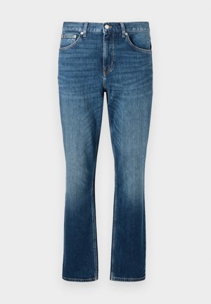 Modré džíny z denimu se rovnou nohavicí, s přechodem od světlé po tmavou barvu, předními kapsami a kovovým zapínáním.