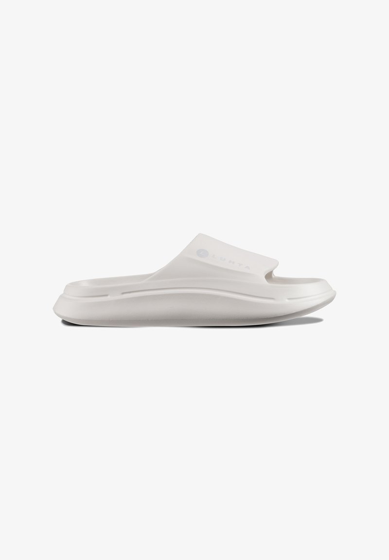 White slip-on sandal with a smooth, matte finish, rounded toe, and subtle design features. Lightweight material with a contoured sole.