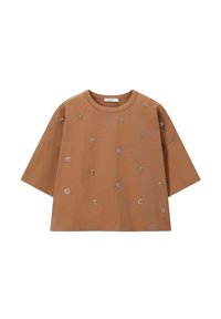 Haut marron à manches courtes en coton, avec des accents de broderie florale, coupe décontractée et col rond.