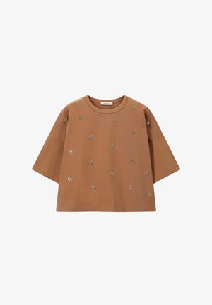 Bruine kortlopende top van katoen, met geborduurde bloemenaccenten, een ontspannen pasvorm en een ronde halslijn.