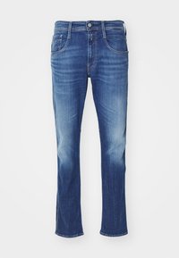 Denimjeans i blått med en blekt tvätt, rak benklippning, femfickorsdesign och metallknappstängning i midjan.