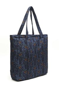 Sac fourre-tout matelassé en tissu bleu foncé avec un motif floral orange et jaune couvrant toute la surface. Deux bretelles solides et une forme rectangulaire.