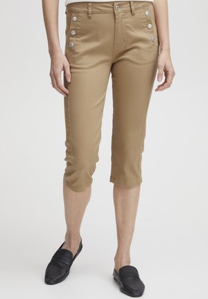 Pantalons cropped kaki en mélange de coton, dotés de cinq accents de boutons en argent sur le devant, de poches latérales et d'une coupe ajustée.