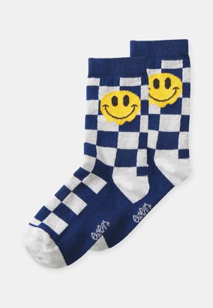 Marineblaue und weiße karierten Socken mit einem gelben Smiley-Design, aus softem Material mit geripptem Bündchen und verstärkter Zehenpartie.
