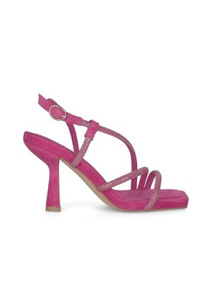 Pink suede heeled sandal with a square toe, thin straps, and rhinestone accents. Features an adjustable ankle strap and a tapered heel.