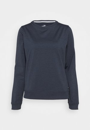 Dunkelblauer Pullover mit Rundhalsausschnitt und langen Ärmeln, mit gerippten Bündchen und Saum, versehen mit einem kleinen Puma-Logo nahe dem unteren Saum.