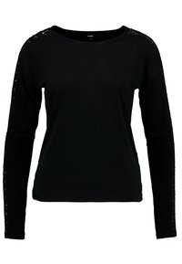 Schwarzes Langarmshirt aus weichem Stoff. Mit offenen Weave-Details an den Schultern und einem runden Ausschnitt. Einfaches und figurbetontes Design.