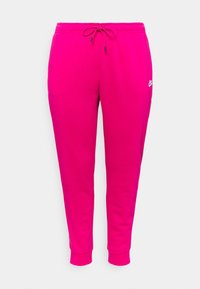 Růžové Nike tepláky s elastickým pasem, nastavitelnou šňůrkou a zúženými nohavicemi; mají malé logo na levém boku.