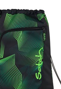 Drawstring backpack in black with green geometric pattern. Features a zipper pocket and branded accent, made from durable fabric.