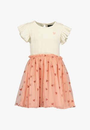 Kremowy prążkowany top z krótkimi falbanianymi rękawkami, ozdobiony różowym sercem; warstwowa brzoskwiniowa spódnica tiulowa z małymi wzorami serc.