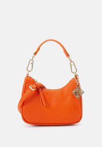 Orange synthetic handbag with a curved shape, gold hardware accents, adjustable strap, and embossed logo detail. Smooth texture, minimalist design.