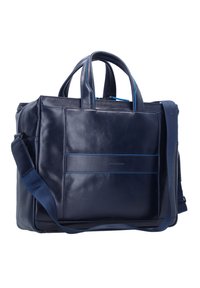 Borsa in pelle blu navy con doppi manici e una tracolla staccabile. Presenta accenti blu a contrasto e una texture liscia con una tasca frontale.