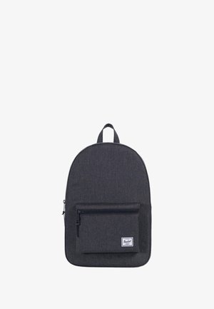 Sac à dos en tissu gris de forme arrondie, avec une poche zippée à l'avant et une poignée sur le dessus pour le transport. Design simple, sans motifs ni accents.