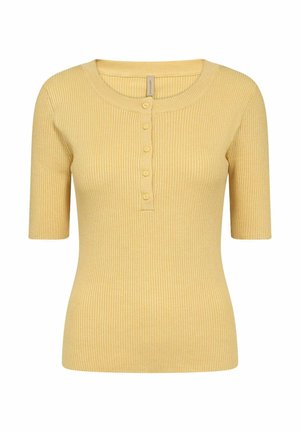 Kollane ribakujuline lühikeste varrukatega pluus ümarate kaelustega ja nööbiga esiosas. Valmistatud pehmest, tekstuuriga kangast.