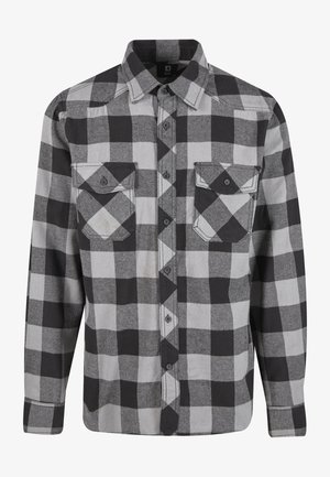 Fekete és szürke kockás flanel ing hosszú ujjakkal, két mellzsebbel, lekerekített gallérral, gombos elülső résszel és texturált anyaggal.