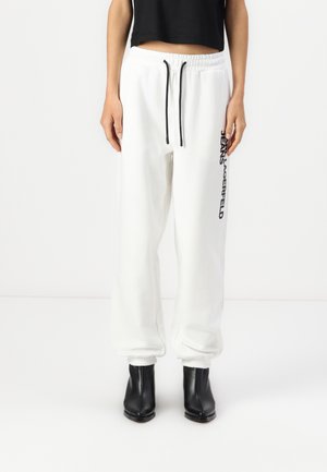 TEXT LOGO SLIM - Tracksuit bottoms - white