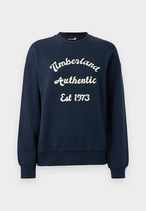 Temno moder pulover z belim napisom "Timberland Authentic Est 1973," z okroglim izrezom in rebrastimi manšetami.