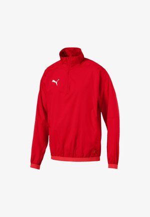 Rote Windjacke mit halbem Reißverschluss am Kragen, elastischen Bündchen und Saum. Verfügt über ein weißes Puma-Logo auf der linken Brust. Glatte Textur.
