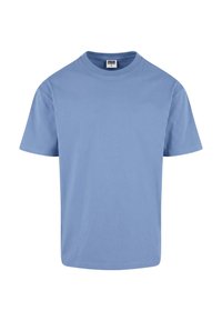 T-shirt bleu clair à manches courtes et col rond avec une étiquette de taille moyenne au col, présenté sur fond blanc.