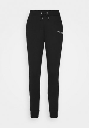 Zwarte taps toelopende sweatpants met elastische tailleband en trekkoord, geribbelde boorden en klein wit "Armani Exchange" logo op de bovenkant van het dijbeen.