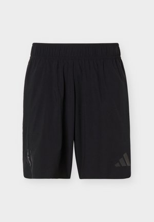 Sorte atletikshorts med elastisk taljebånd, med diskret Adidas-logo på højre ben og teamemblem på venstre ben.