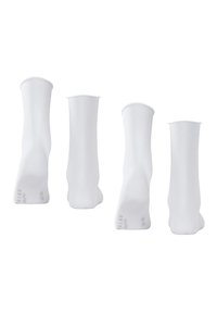 White athletic socks displayed from multiple angles, featuring a smooth texture and elastic cuffs, with size markings on the sole.