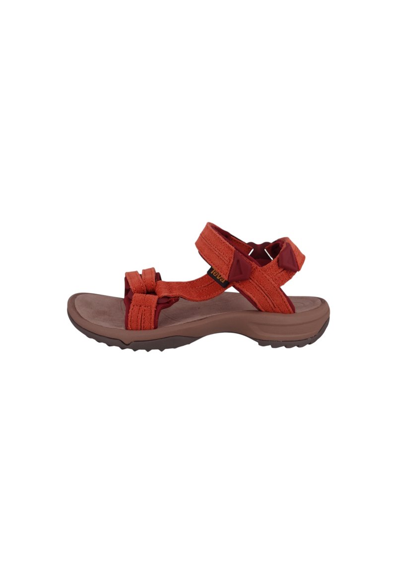 Adjustable orange fabric sandals with two crossed straps and a thick brown rubber sole, featuring textured tread for grip.