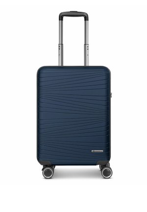 Valise rigide bleu marine avec motifs de lignes diagonales, quatre roues pivotantes et une poignée télescopique étendue.