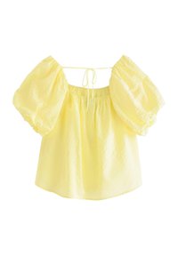 Gul, lättviktig topp med pösiga ärmar, elastisk halsringning och knytning i ryggen. Har en texturerad tyg för extra visuell intresse.