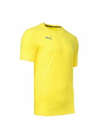 Żółta koszulka sportowa z krótkim rękawem, wykonana z oddychającego materiału, z subtelną teksturą i szarym logo Pumy na piersi.