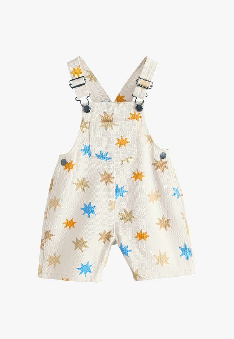 Salopette crème pour tout-petit avec bretelles réglables, poche avant, boutons latéraux et motif d'étoiles bleues, orange et beige.