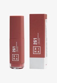 Långvarigt läppstift i en matt rostfärgad tub, med en klar bas och detaljerad förpackning med vit text på en röd låda.