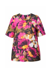 Blusa corta de manga corta con estampado floral en colores vibrantes de rosa, amarillo y blanco sobre un fondo oscuro. Elaborada con tejido ligero y suave.