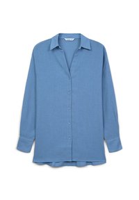 Camicia azzurro chiaro a maniche lunghe realizzata in tessuto intrecciato. Presenta una chiusura con bottoni, colletto a punta e una vestibilità rilassata con fessure laterali.