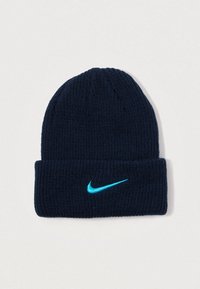 Gorro de malha azul-marinho com a bainha dobrada, apresentando um logótipo da Nike em turquesa na frente. Textura suave e design ajustado.
