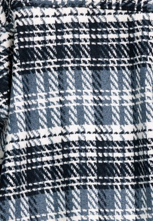 Geruite stof in marineblauw, zwart en wit met een zachte textuur. Bevat een herhalend patroon van vierkanten en lijnen. Geschikt voor warme kleding.