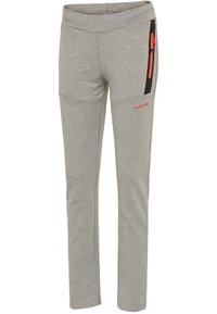 Grå idrottsbyxor i mjukt tyg, med en fitted design, sidofickor med dragkedja i orange detaljer och en rosa logotyp framtill.