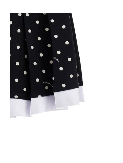 Μαύρο ύφασμα με λευκά πουά και λευκό τελείωμα, με διπλωμένες λεπτομέρειες και διακριτικό κείμενο "Monnalisa" στο σχέδιο.