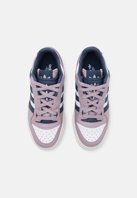 Pair of purple, white, and navy Adidas sneakers with laces, three stripes on sides, and perforated toe boxes, viewed from above on white background.