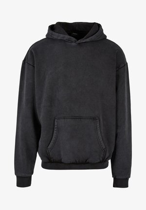 Černá mikina s kapucí vyrobená z měkké bavlněné směsi. Obsahuje přední kapsu, elastické manžety a lem. Casual, volný střih.